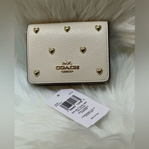Coach Mini Wallet On A Chain
With Heart Rivets